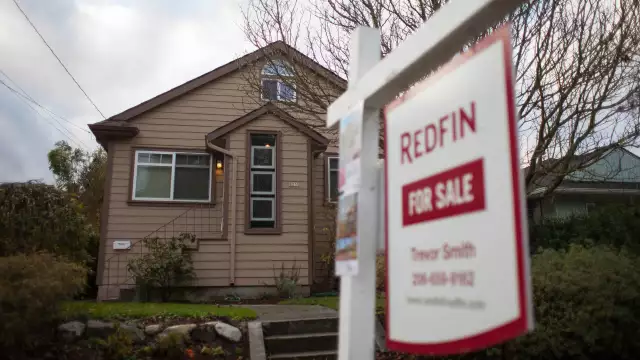 Real estate firms Compass and Redfin announce layoffs as housing market slows