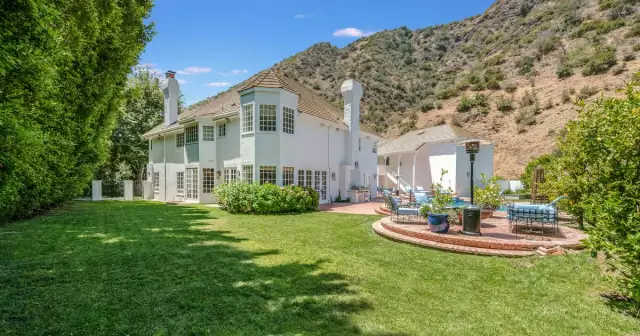 Magic Johnson’s former mansion, complete with a basketball court, asks $14.5 million